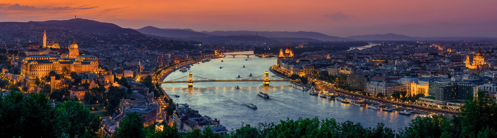 Budapest’s Danube bridges and Buda Castle lit up at dusk